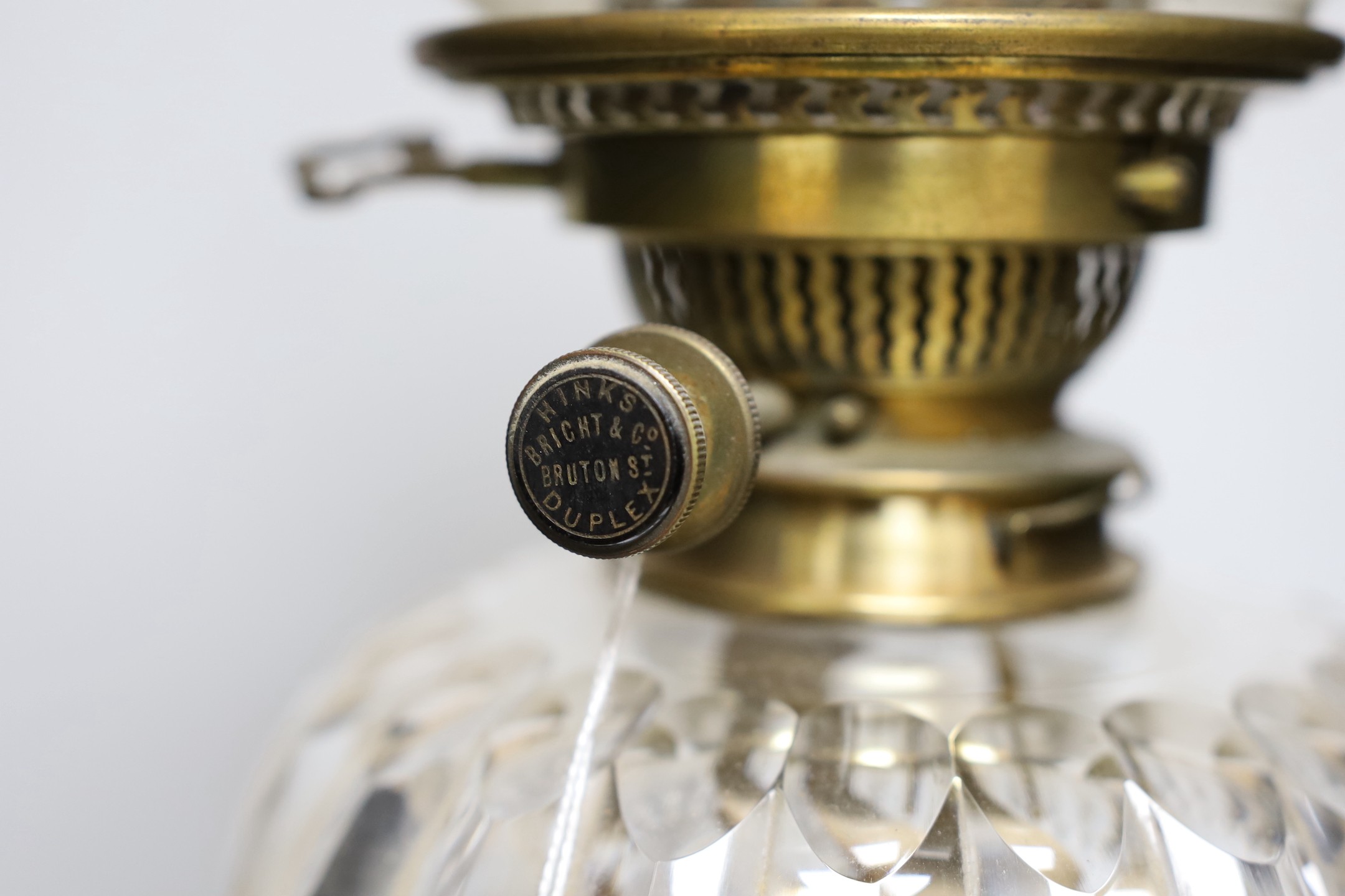 A Victorian clear glass oil lamp. 73cm tall